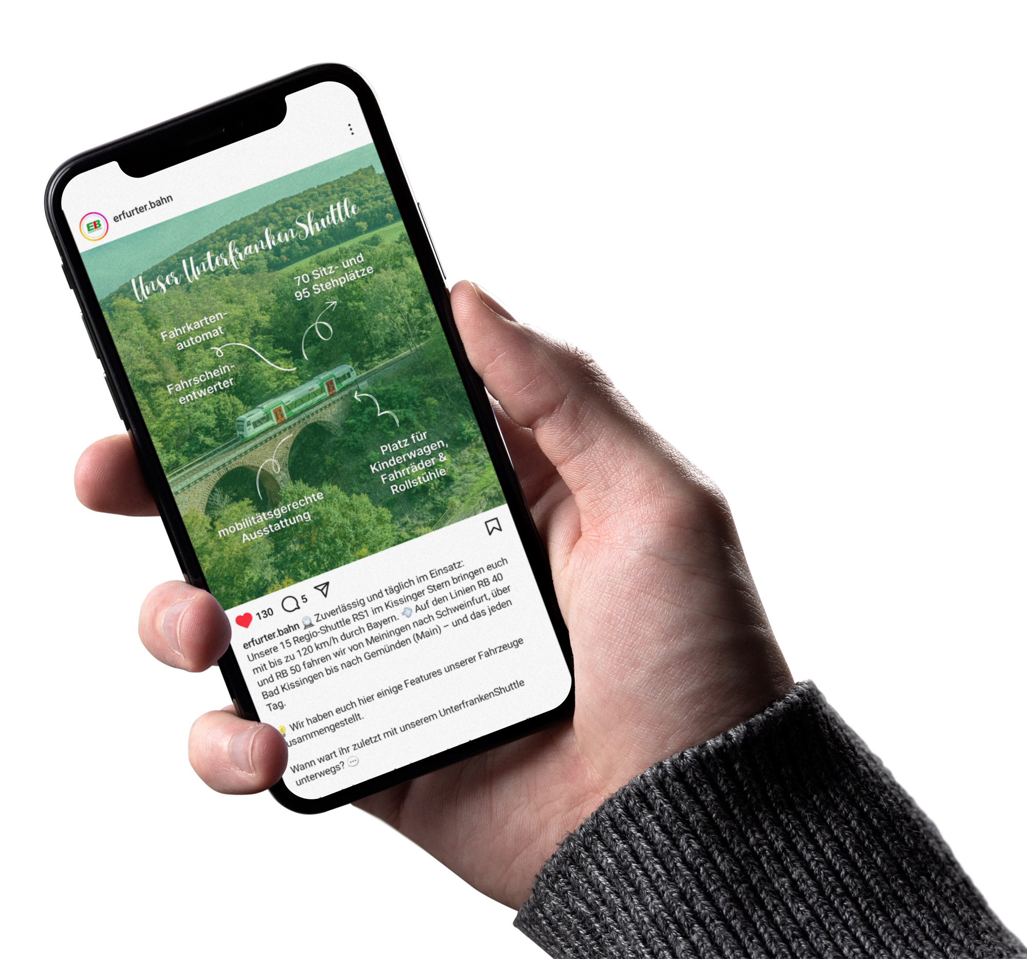 Eine Hand hält ein Smartphone, vor weißem Hintergrund. Auf dem Display ein Instagram-Beitrag der Erfurter Bahn zum Thema "Unterfranken-Shuttle"